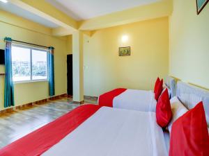 Postel nebo postele na pokoji v ubytování Gaurika Residency Boarding & Lodging - Padubidri