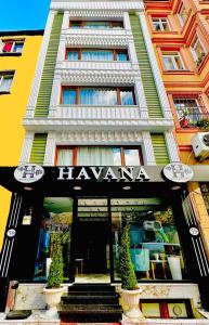 a large building with a hawaiiana sign on it at TAKSİM HAVANA HOTEL SUİTES in Istanbul