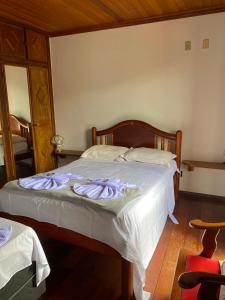 Ein Bett oder Betten in einem Zimmer der Unterkunft Casa do Alferes