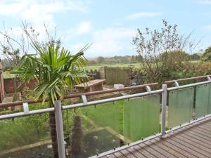 a balcony with a view of a garden at Tonga Cottage 302 Over Lane in Belper