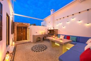 A seating area at Lindos Allure Villa with Jacuzzi and Acropolis view!!!