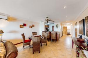 a living room with a table and chairs at Oceanica 804 in Playa Flamingo