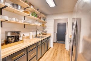 a kitchen with a stainless steel refrigerator and wooden counters at Travel for work - Stylish 3 BDR - Southern Georgia in Moultrie