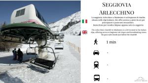 a ski lift with people on it in the snow at Appartamento Fondo Valle a 1 minuto dalle piste in Madesimo