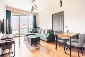 a living room with a couch and a table at Benesta Taksim No.8 in Istanbul
