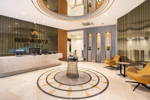 a lobby with a waiting area with yellow chairs at Benesta Taksim No.8 in Istanbul +25 photos
