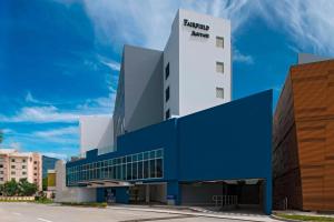 a building with a blue and white building at Fairfield by Marriott San Salvador in San Salvador