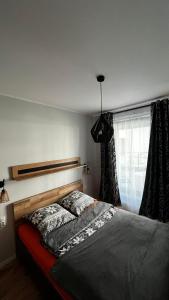 Voodi või voodid majutusasutuse U Tommiego w Gdyni toas