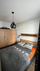 Voodi või voodid majutusasutuse U Tommiego w Gdyni toas