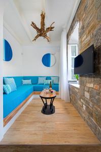 A television and/or entertainment centre at Lindos Allure Villa with Jacuzzi and Acropolis view!!!