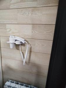 a phone hanging on a wall in a room at LOVE SPA in Oye-Plage