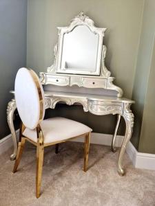 a white dressing table with a mirror and a chair at The Hamilton Luxury Let-The Duke in Scorton