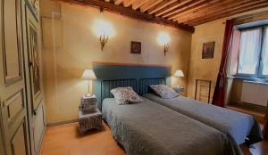 Ένα ή περισσότερα κρεβάτια σε δωμάτιο στο Vieux-Lyon - Maison Renaissance
