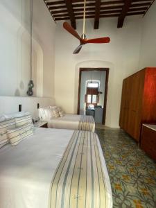 Postel nebo postele na pokoji v ubytování Las Lupitas Hotel Boutique