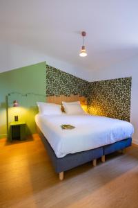 Posteľ alebo postele v izbe v ubytovaní Hôtel - Lodges de Lemptégy