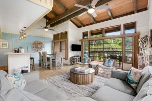 a living room with a couch and a table at Mauna Kai 8 in Princeville