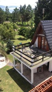 an aerial view of a house with a deck at DINASTIE COUNTRY APART in Villa Rumipal