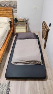 Postel nebo postele na pokoji v ubytování 山林間 - 露營 旅居 Camping & BNB in forests 預訂後請看訊息
