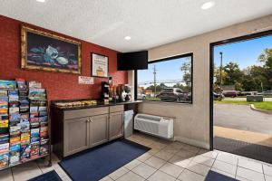 a coffee shop with a counter and a window at Americas Best Value Inn Laurel in Laurel