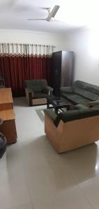 a living room with two couches and a table at Service Apartment at Brookefield in Bangalore