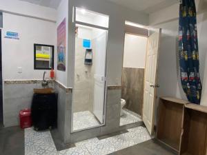 a bathroom with a shower and a toilet at Combi in Salento
