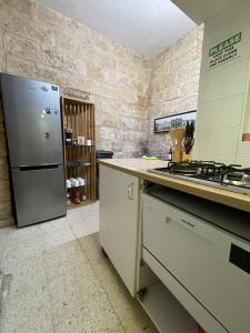 A kitchen or kitchenette at Sliema's Seaside Charmer