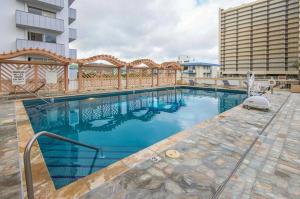 a swimming pool in the middle of a building at Island Colony 4309 - 30-Night Minimum in Honolulu