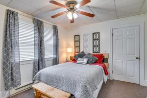 a bedroom with a bed and a ceiling fan at Cozy Mohawk Getaway Near Herkimer Diamond Mines 