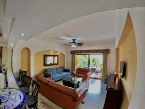 a living room with a couch and a table at Oceanview Condo Vela Vallarta condo in Puerto Vallarta