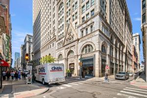 a ups truck parked in front of a building at New! Charming Home In Heart of City With King Size Bed! in Philadelphia