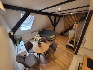 an overhead view of a living room with a table and chairs at Studio apartman Mia in Zagreb