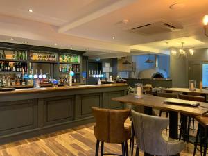 a bar in a restaurant with a table and chairs at Anchor Down at The Bay, sleeps 4-6 in 2 bedrooms, dogs welcome too in Filey