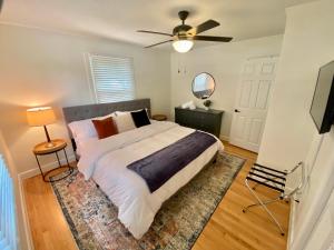 a bedroom with a bed and a ceiling fan at Pack your bags and leave tonight! in Wilmington