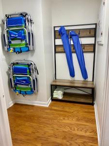 a walk in closet with two blue umbrellas at Pack your bags and leave tonight! in Wilmington