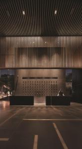 a building with two benches in the middle of a room at G Hotel Kelawai in George Town
