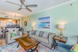 a living room with a couch and a table at Palacio Unit 805 in Pensacola