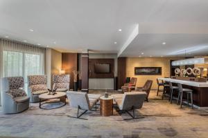 a lobby of a hotel with chairs and a table at Courtyard by Marriott Waldorf in Waldorf