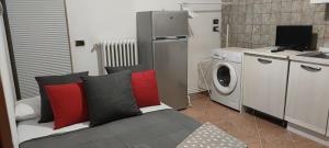 a living room with a couch and a washing machine at Da Anna e Michele in Andria +55 photos