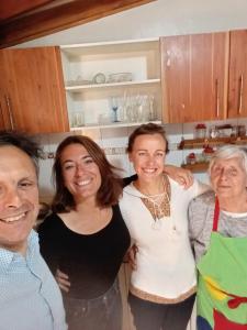 a group of people standing in a kitchen at Hostal Maria Casa in La Serena