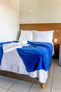 Cama ou camas em um quarto em POUSADA CAJUEIRO