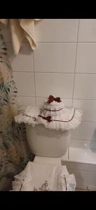 a toilet in a bathroom with a pile of toilet paper at Departamento Centro de La Florida in Santiago