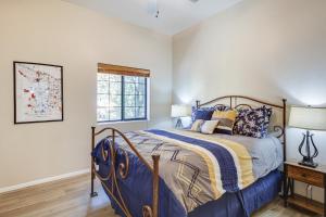 a bedroom with a bed and a window at Tucson Condo Rental with Balcony and Mountain View! in Tucson +16 photos