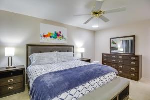a bedroom with a bed and a ceiling fan at Tucson Townhome with Shared Pool in 55 and Community! in Tucson