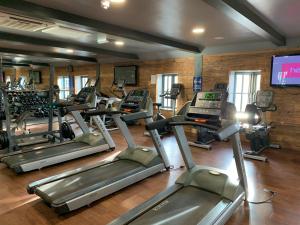 a gym with several tread machines and a tv at Seahorse Lodge at The Bay Filey, sleeps up to 6, and 2 dogs stay for free! in Filey