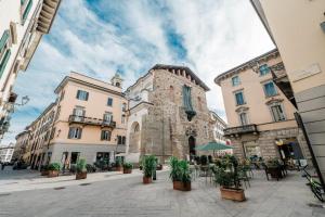 a street in a city with buildings and plants at P&P Borgo Apartment in Bergamo