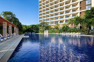 The swimming pool at or close to Four Points by Sheraton Wuchuan, Loong Bay