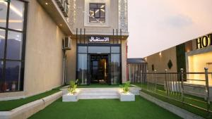 a building with a green lawn in front of it at برج بيات in Jazan