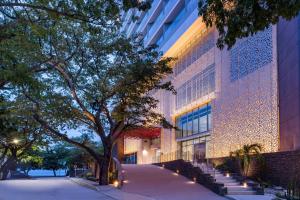 a building with lights on the side of it at Hilton Santa Marta in Santa Marta