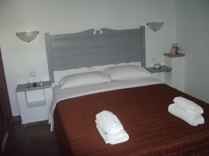 Postel nebo postele na pokoji v ubytování Skyros Panorama Studios + 37 fotografií
