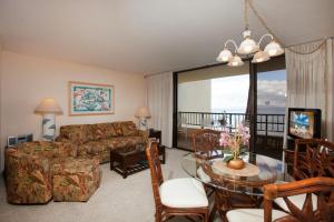 a living room with a couch and a table at Sugar Beach 317 - MCH in Kihei